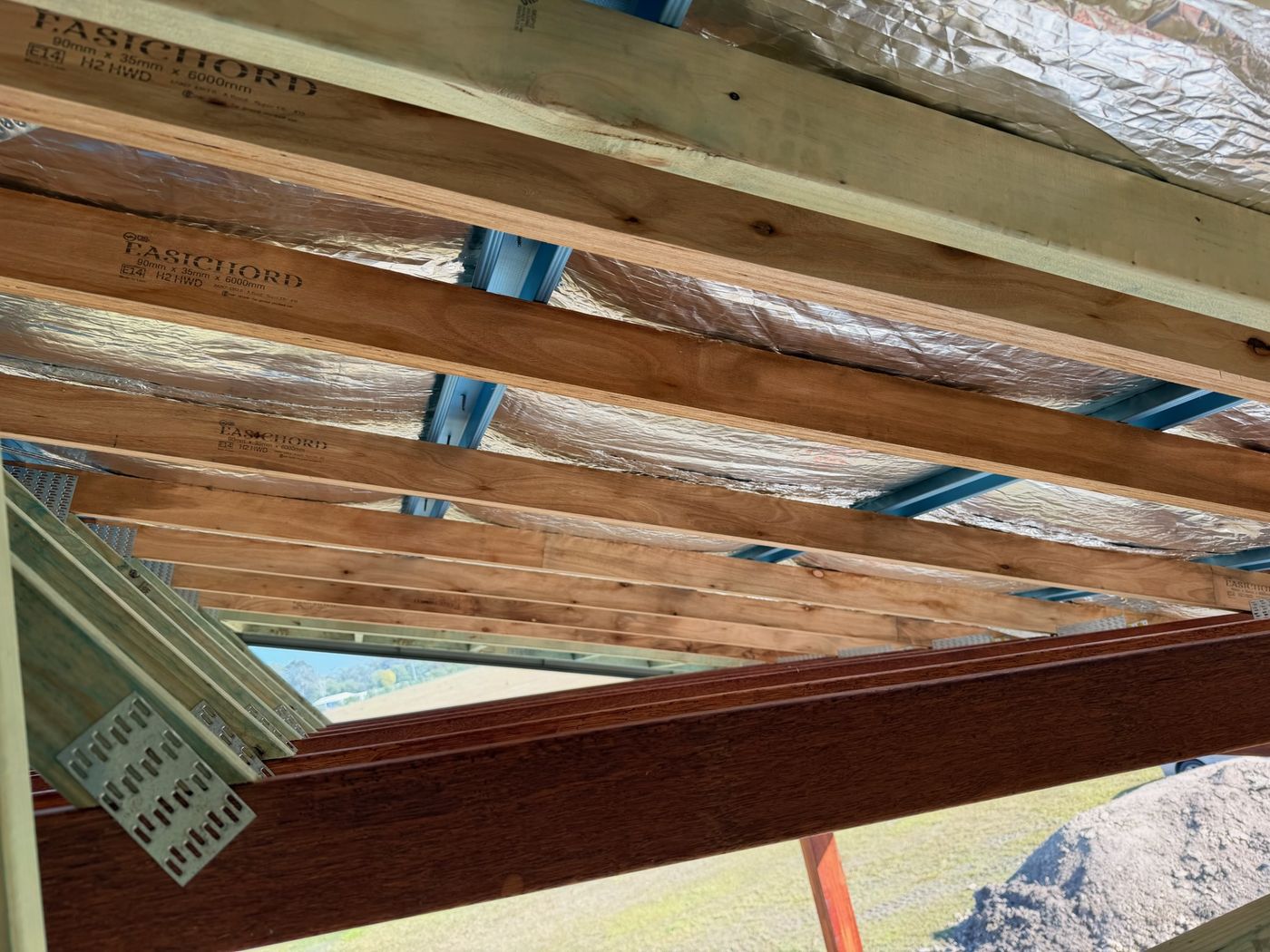EasiChord LVL rafters stamped E14 H2 under foil insulation