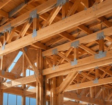 Large timber building with an exposed engineered-wood roof structure
