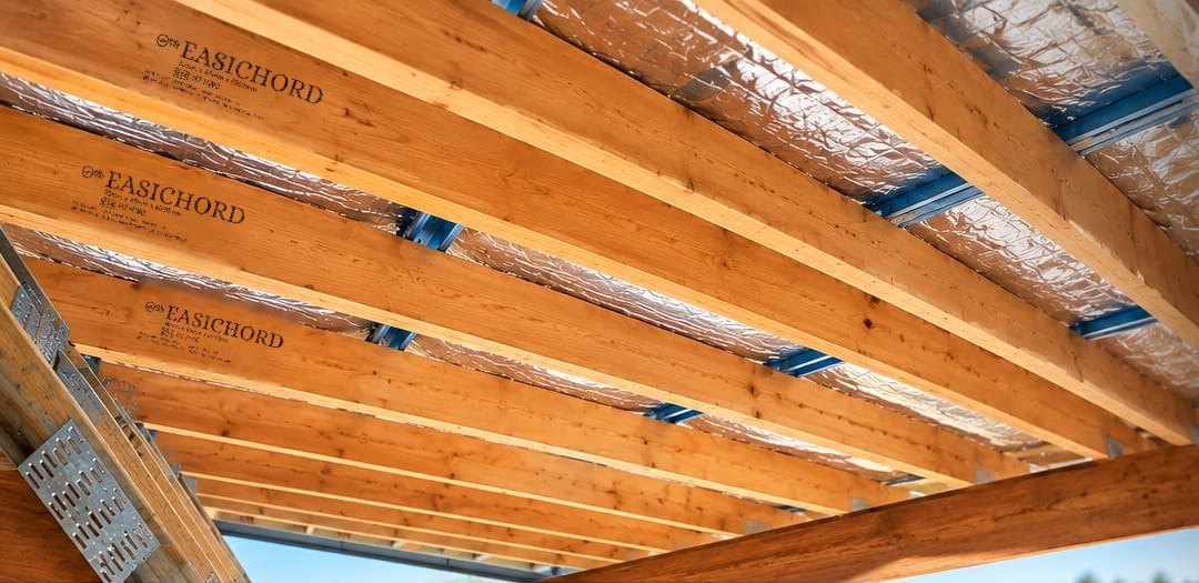 EasiChord LVL rafters, stamped, under a roof in bright daylight